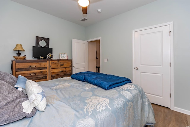 40 Parkside Dr, Pawleys Island, SC 29585 - bedroom featuring wood finished floors, ceiling fan, and baseboards