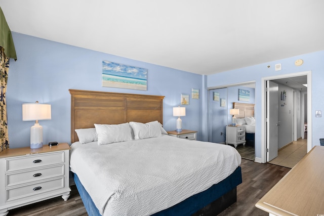 bedroom featuring a closet and dark wood-style floors