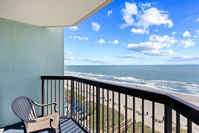 balcony with a beach view and a water view