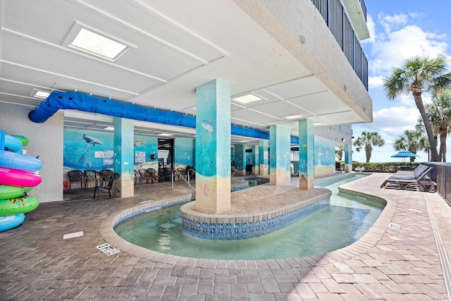 view of pool featuring a patio area