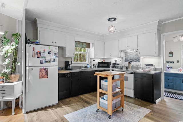 kitchen featuring black appliances, white cabinets, ornamental molding, light wood-style flooring, and a sink