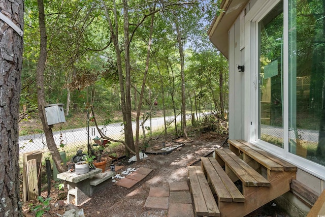 view of patio / terrace with entry steps and fence