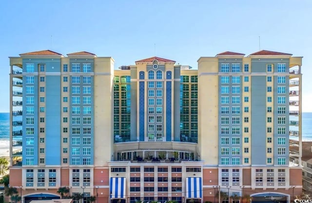 view of building exterior with a water view