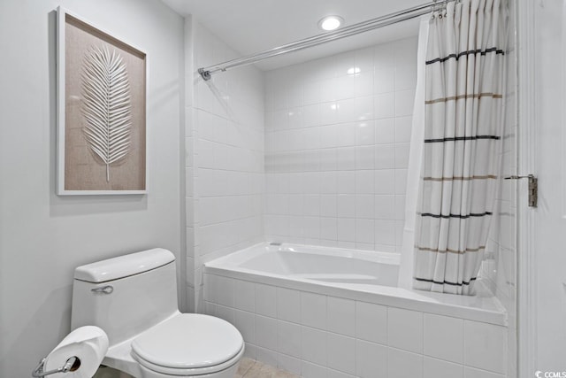 full bathroom with tiled shower / bath combo, toilet, recessed lighting, and tile patterned floors