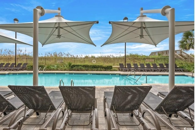 community pool featuring fence