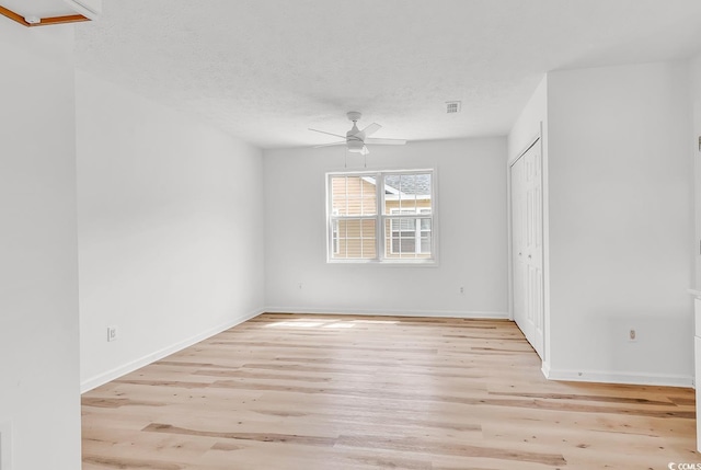 9616 Sullivan Dr, Murrells Inlet, SC 29576 - empty room featuring a ceiling fan, baseboards, visible vents, and light wood-style flooring