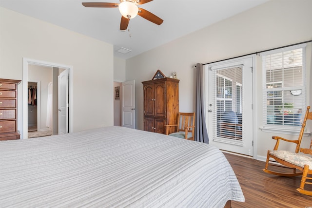 bedroom with access to exterior, wood finished floors, a ceiling fan, and baseboards