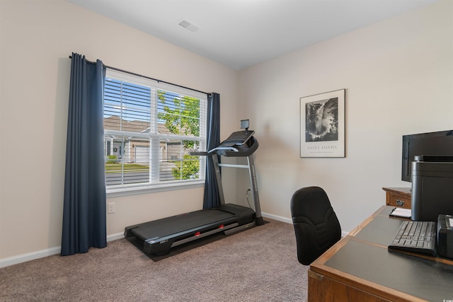 carpeted home office featuring baseboards
