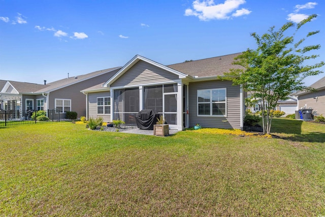 back of property featuring a sunroom