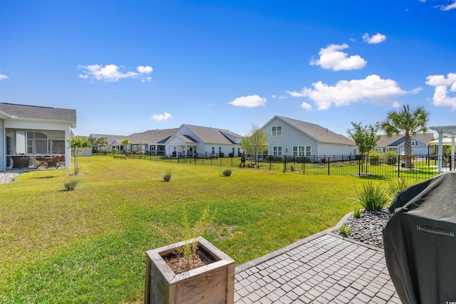 view of yard featuring a residential view and a patio