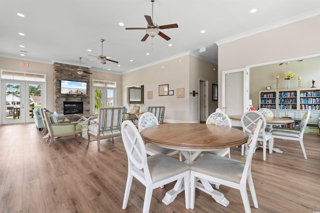 dining area featuring a ceiling fan, ornamental molding, recessed lighting, light wood-style floors, and french doors
