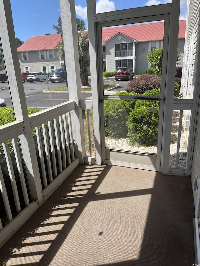 balcony with covered porch and a residential view