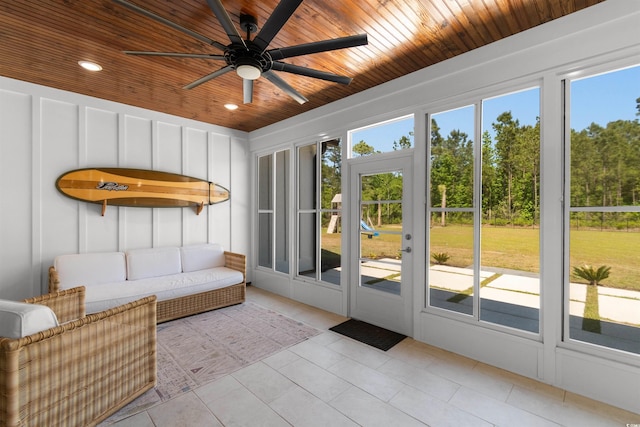 sunroom with ceiling fan and outdoor lounge area