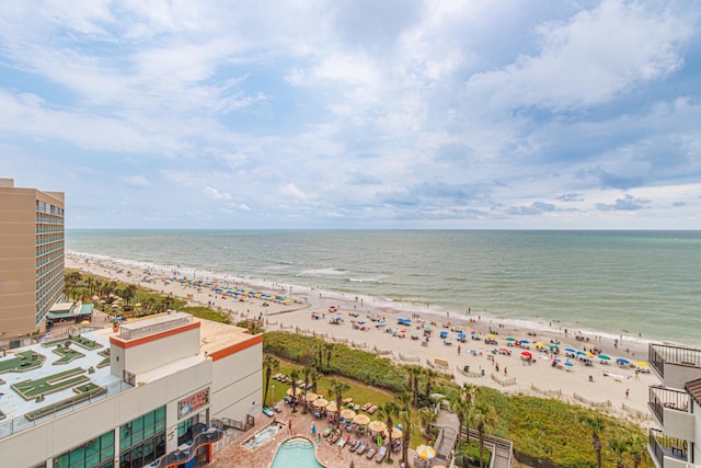 drone / aerial view with a beach view and a water view