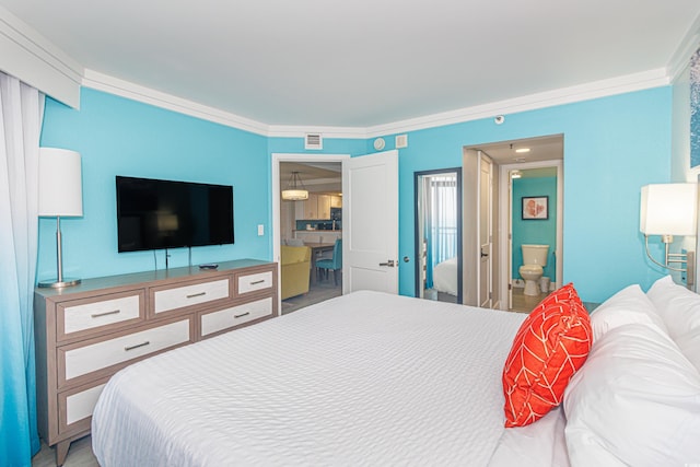 bedroom with ensuite bathroom and visible vents