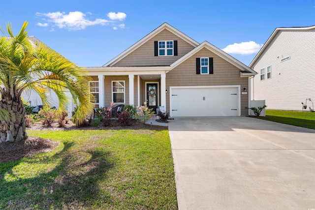 315 Cattle Drive Cir, Myrtle Beach, SC 29588 - craftsman-style home featuring driveway, a front lawn, a porch, and an attached garage