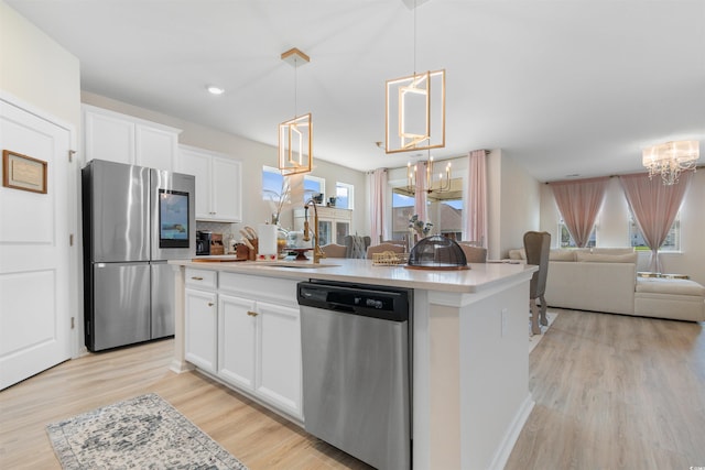 315 Cattle Drive Cir, Myrtle Beach, SC 29588 - kitchen with appliances with stainless steel finishes, a chandelier, open floor plan, a sink, and healthy amount of natural light