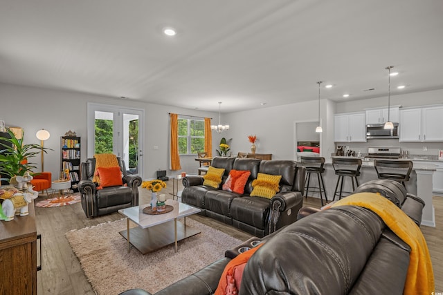 847 Flowering Branch Ave, Little River, SC 29566 - living room featuring light wood finished floors, a chandelier, and recessed lighting