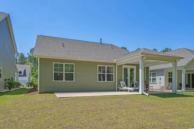 847 Flowering Branch Ave, Little River, SC 29566 - back of house with a yard, a patio area, and roof with shingles