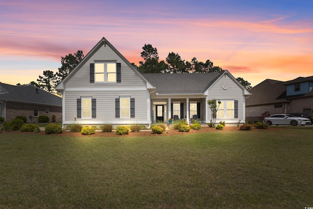 view of front of home featuring a porch and a front lawn