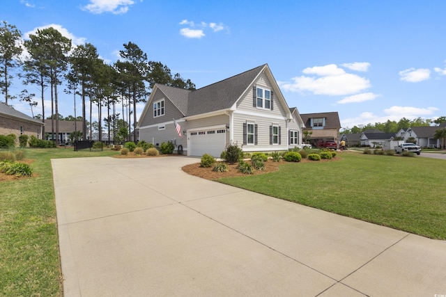 view of side of home with a lawn and concrete driveway
