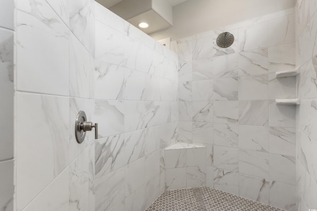bathroom featuring tiled shower
