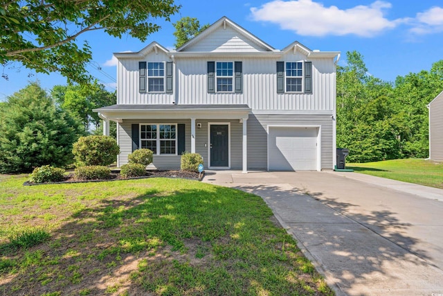 traditional-style home with driveway, a garage, a front lawn, board and batten siding, and a porch