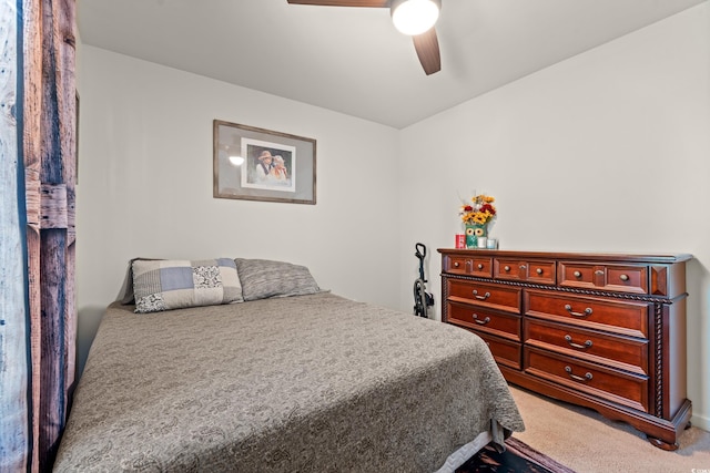 carpeted bedroom with a ceiling fan