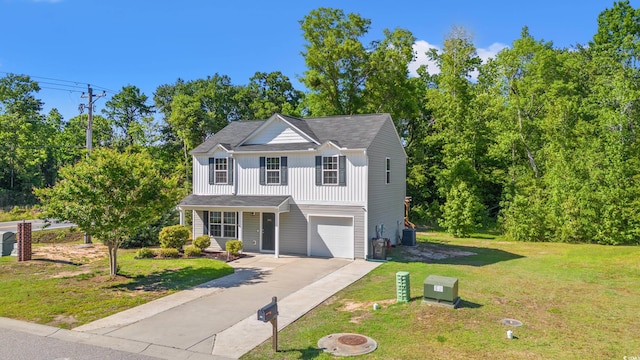 traditional-style home featuring an attached garage, driveway, a front yard, board and batten siding, and central AC unit