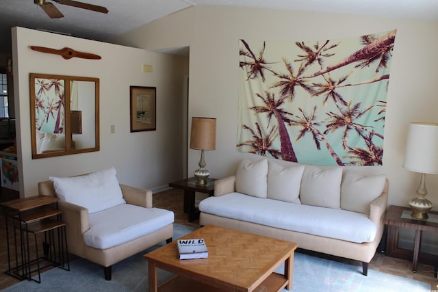 living area featuring a ceiling fan and lofted ceiling