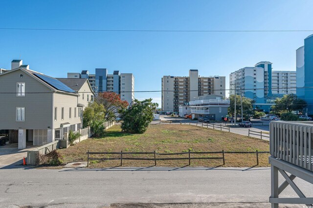 300 47th Ave S Unit 1E, North Myrtle Beach, SC 29582 - view of property's community with fence and a city view