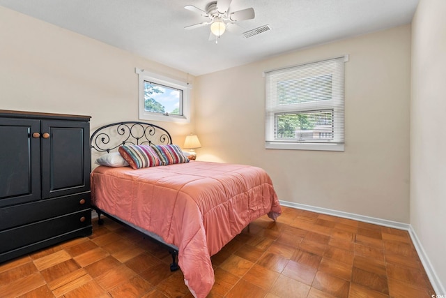 558 Juniper Dr -, Unit Myrtle Beach, SC 29577 - bedroom with baseboards, multiple windows, visible vents, and ceiling fan
