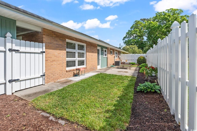 558 Juniper Dr -, Unit Myrtle Beach, SC 29577 - view of yard featuring a patio, a fenced backyard, and a gate