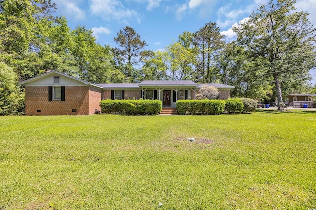 single story home featuring brick siding, crawl space, and a front yard