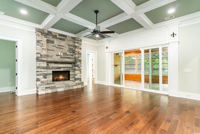 1400 James Island Ave, North Myrtle Beach, SC 29582 - unfurnished living room featuring ceiling fan, a fireplace, ornamental molding, wood finished floors, and coffered ceiling
