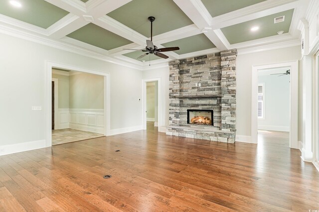1400 James Island Ave, North Myrtle Beach, SC 29582 - unfurnished living room with ceiling fan, coffered ceiling, wood finished floors, beam ceiling, and a fireplace