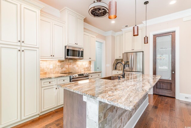 1400 James Island Ave, North Myrtle Beach, SC 29582 - kitchen featuring appliances with stainless steel finishes, a sink, dark wood-style floors, light stone counters, and recessed lighting