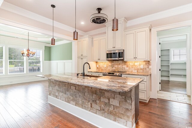 1400 James Island Ave, North Myrtle Beach, SC 29582 - kitchen featuring stainless steel appliances, a sink, dark wood-style floors, light stone counters, and pendant lighting
