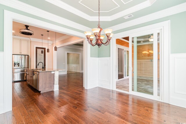 1400 James Island Ave, North Myrtle Beach, SC 29582 - kitchen featuring stainless steel refrigerator with ice dispenser, dark wood finished floors, light stone countertops, a decorative wall, and a sink