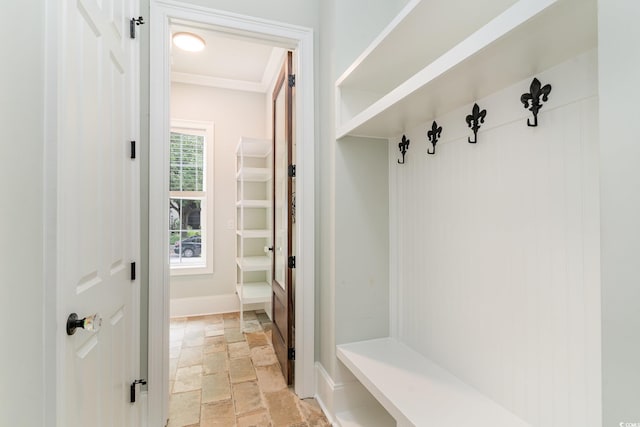 1400 James Island Ave, North Myrtle Beach, SC 29582 - mudroom featuring stone tile flooring, baseboards, and ornamental molding