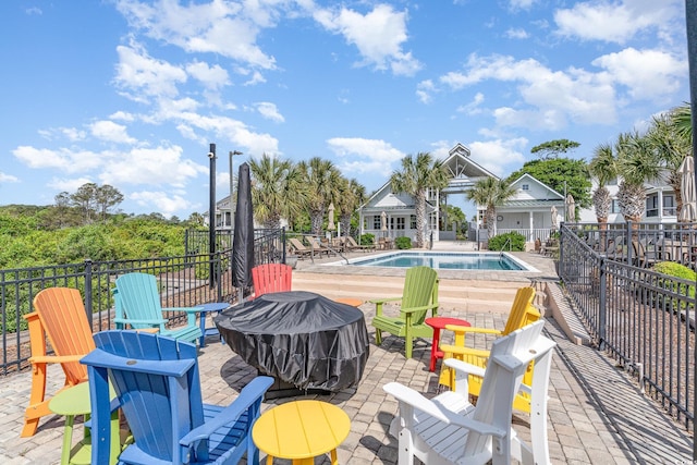 1400 James Island Ave, North Myrtle Beach, SC 29582 - community pool with an outdoor fire pit and a patio area