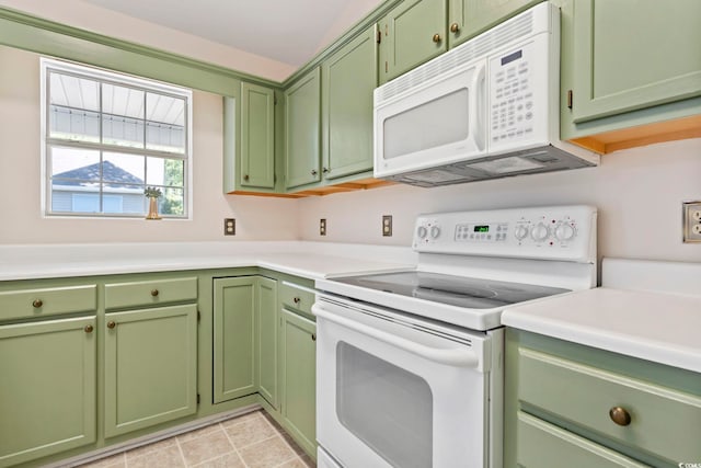 68 Voyagers Dr, Pawleys Island, SC 29585 - kitchen with white appliances, green cabinetry, light countertops, and light tile patterned floors