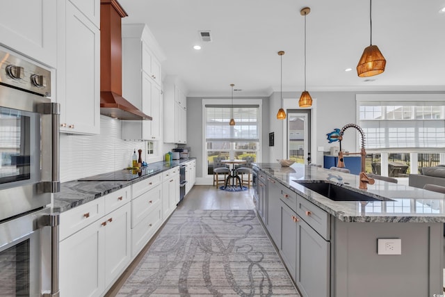 260 Palmetto Harbour Dr, North Myrtle Beach, SC 29582 - kitchen featuring visible vents, an island with sink, plenty of natural light, stainless steel double oven, and a sink