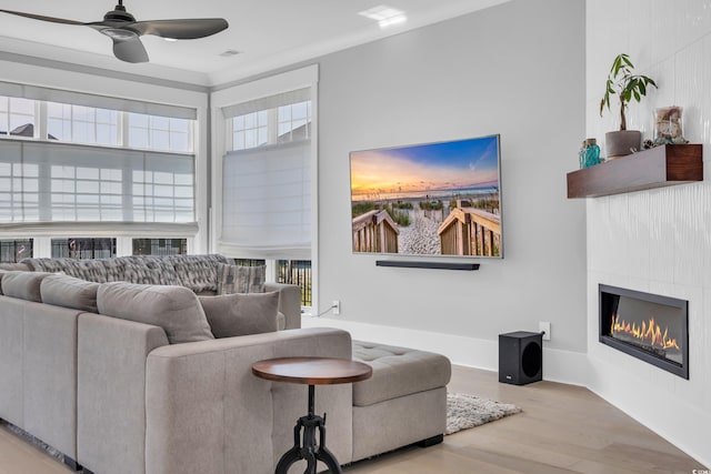 260 Palmetto Harbour Dr, North Myrtle Beach, SC 29582 - living area with a glass covered fireplace, a ceiling fan, and wood finished floors