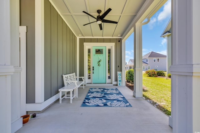 260 Palmetto Harbour Dr, North Myrtle Beach, SC 29582 - view of exterior entry with board and batten siding, a ceiling fan, and covered porch
