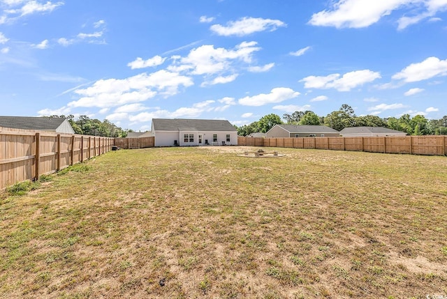 view of yard with a fenced backyard