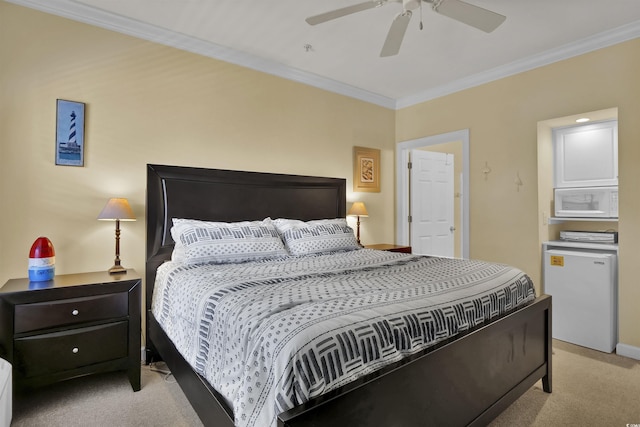 bedroom with crown molding, refrigerator, baseboards, ceiling fan, and light colored carpet