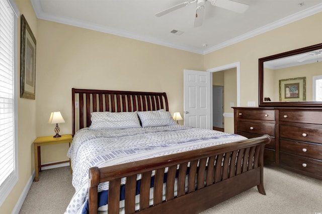 bedroom with crown molding, visible vents, light carpet, baseboards, and a ceiling fan