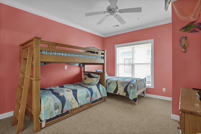 bedroom featuring crown molding, carpet floors, a ceiling fan, baseboards, and visible vents