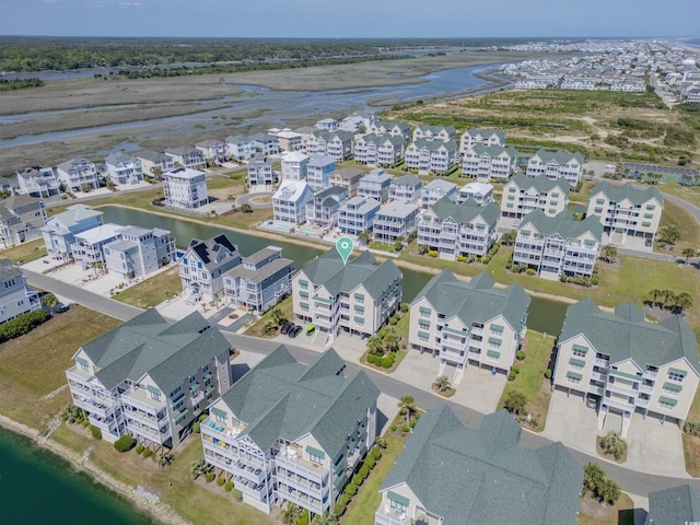 bird's eye view with a residential view and a water view